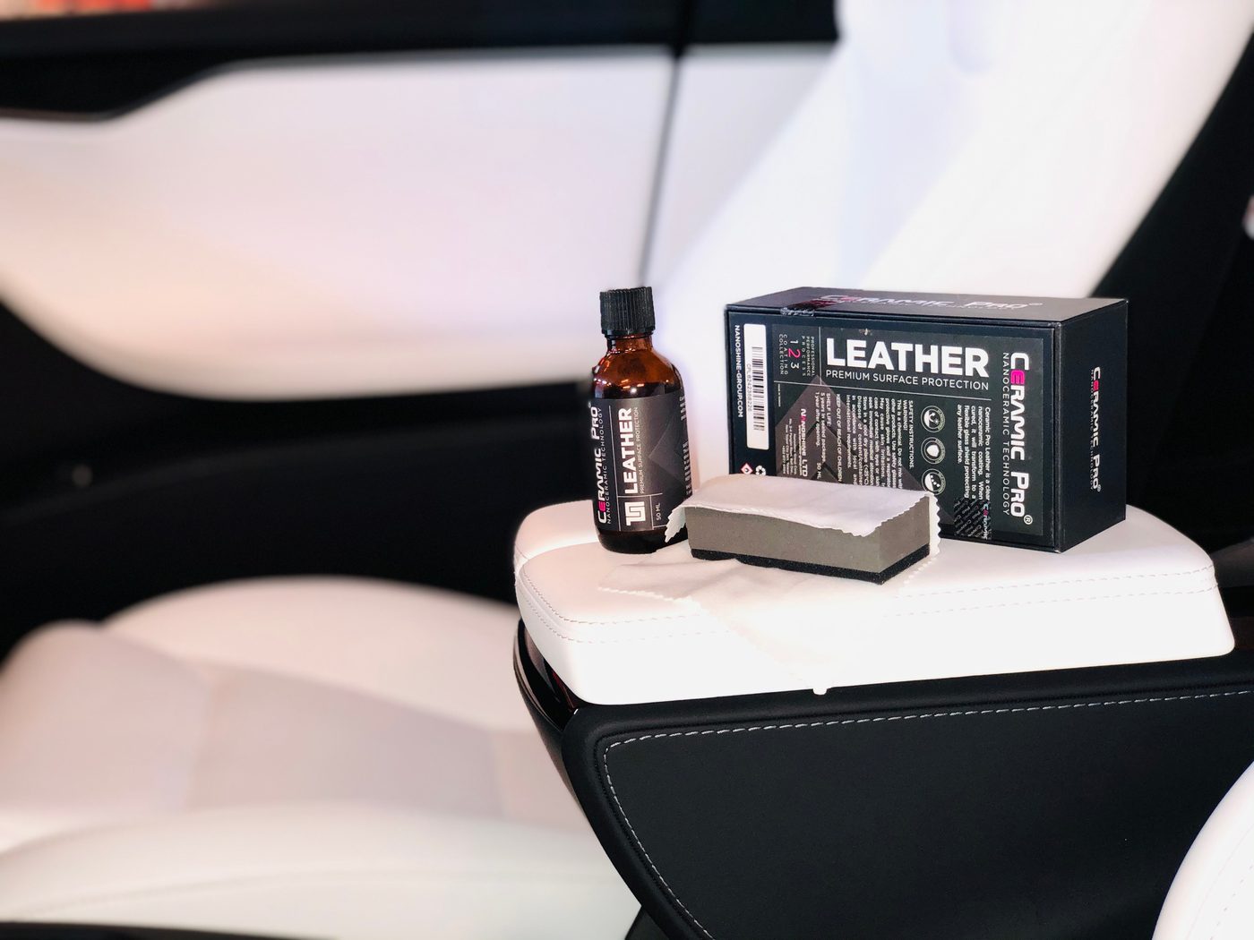 Ceramic Pro Leather bottle and box on a vehicle seat