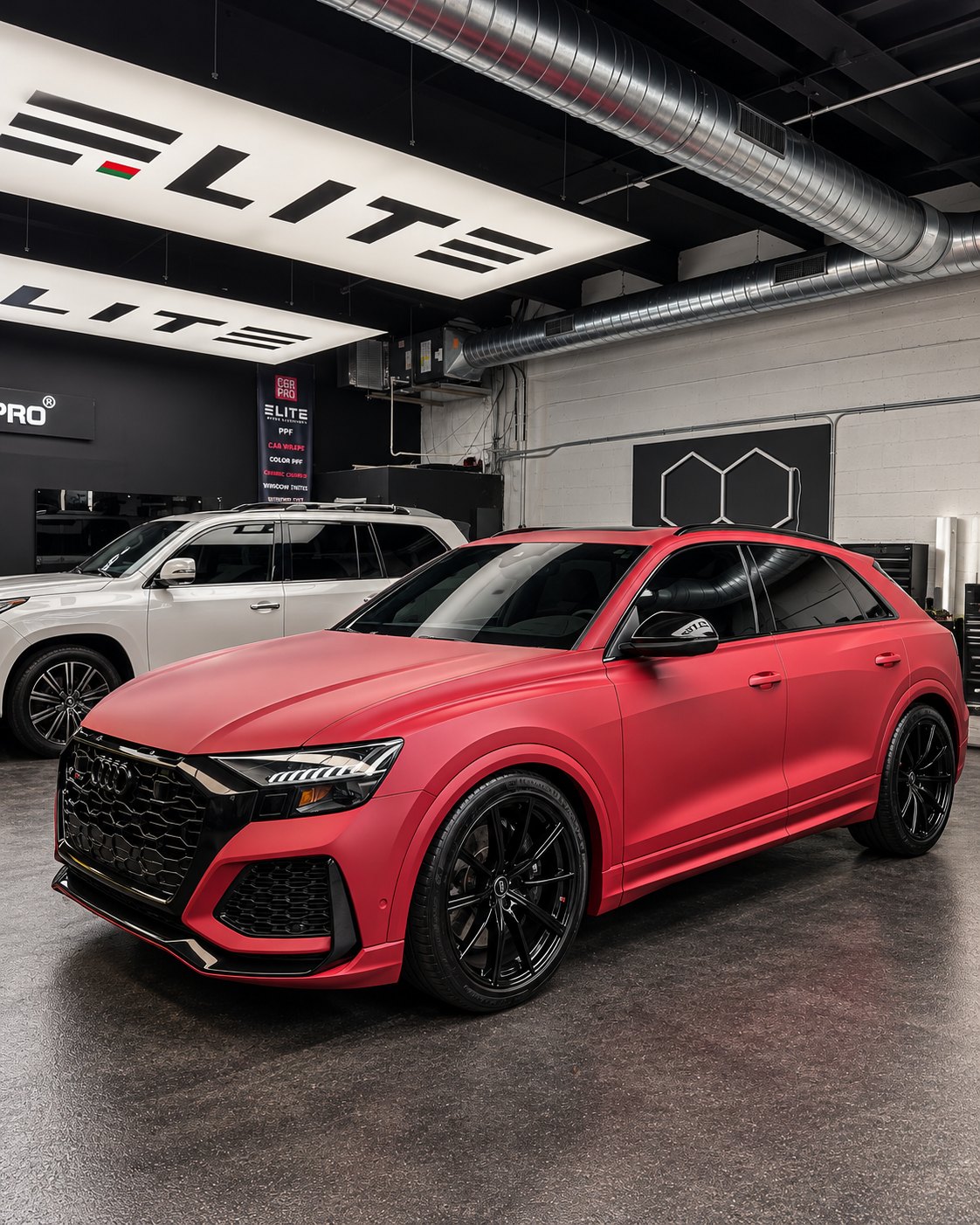 Audi RS Q8 wrapped in satin red inside the new Elite Premium Detailing shop in Davie