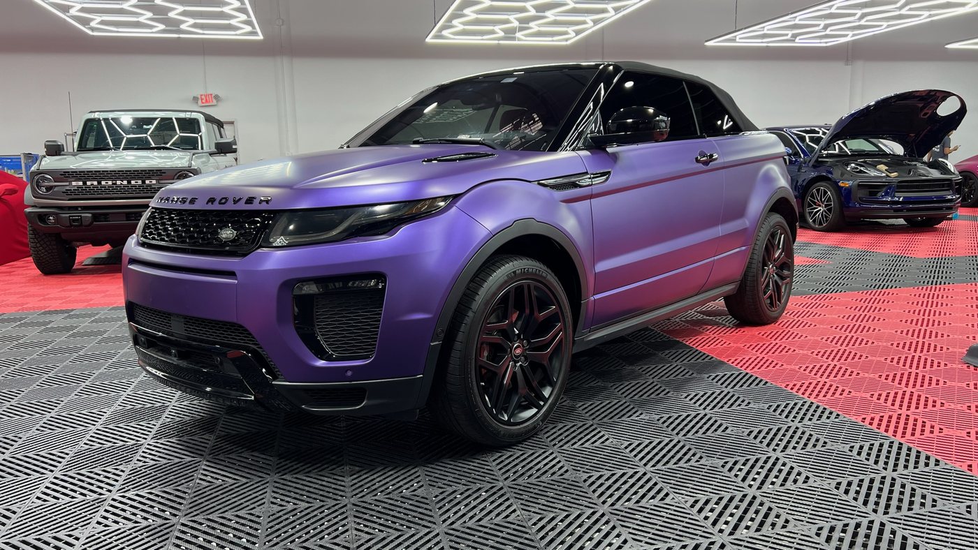 Range Rover Evoque Convertible wrapped in matte purple on the shop floor at Elite Premium Detailing