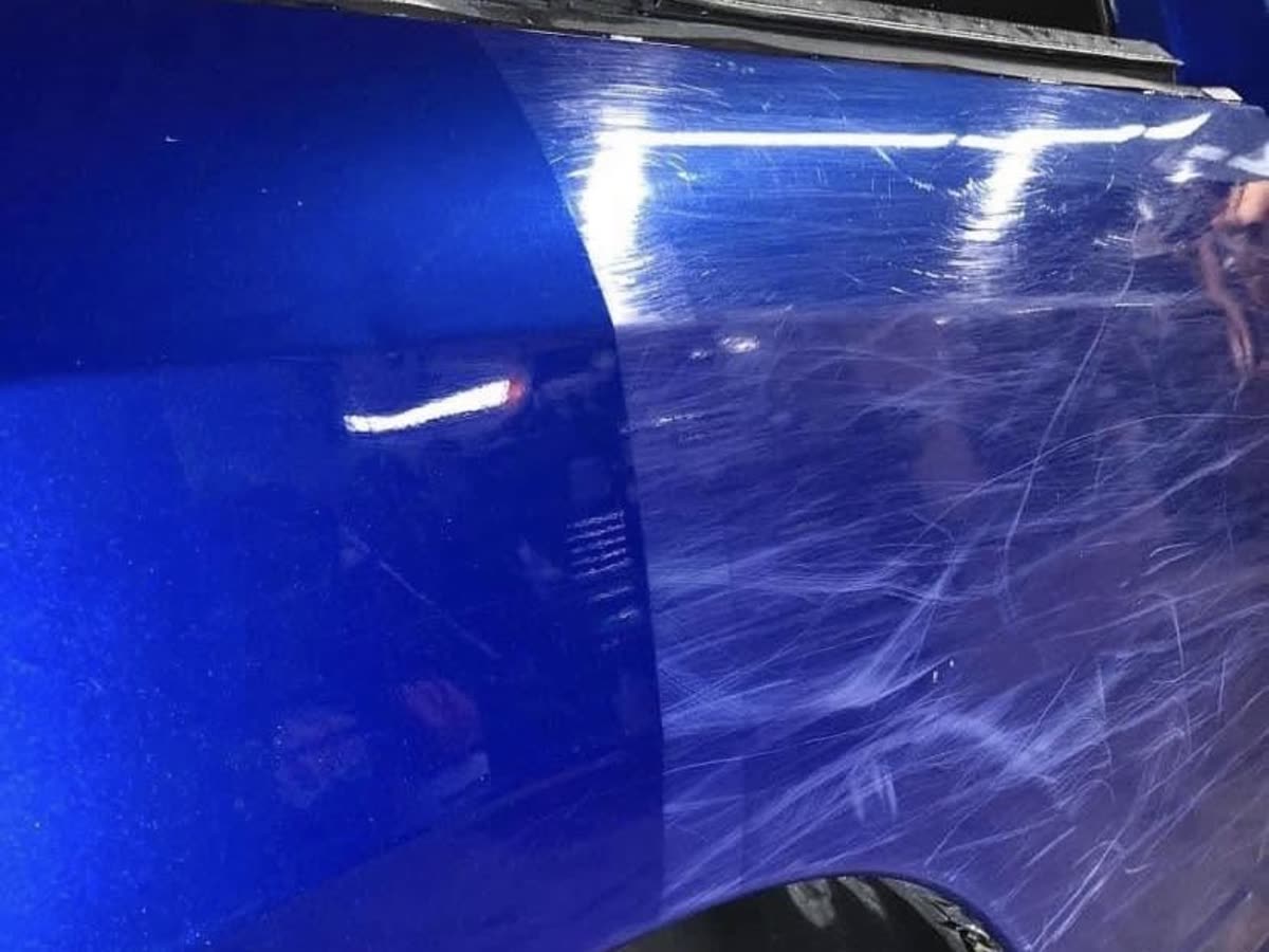 Paint correction 50/50 &mdash; heavy swirls on blue truck paint corrected to a mirror finish