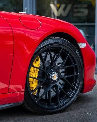 Yellow calipers on a red Porsche 911