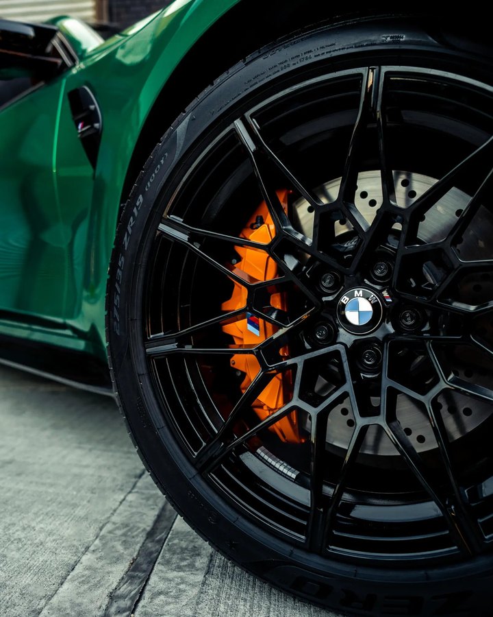 BMW M orange calipers with ceramic coated black wheels