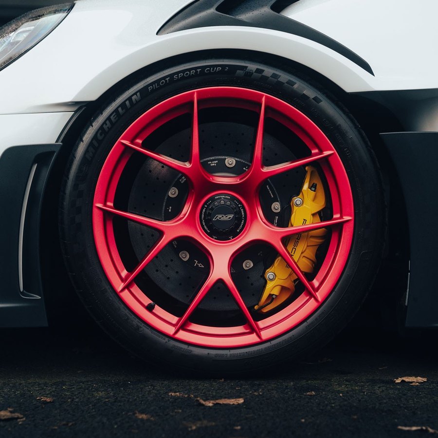 Candy red powder coated wheels on a Porsche 911 at Elite